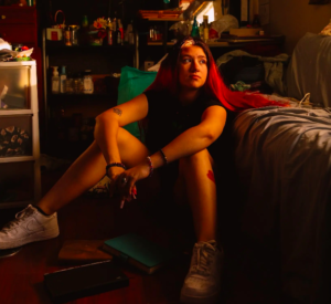 A photo of a young girl with red hair in a camper.